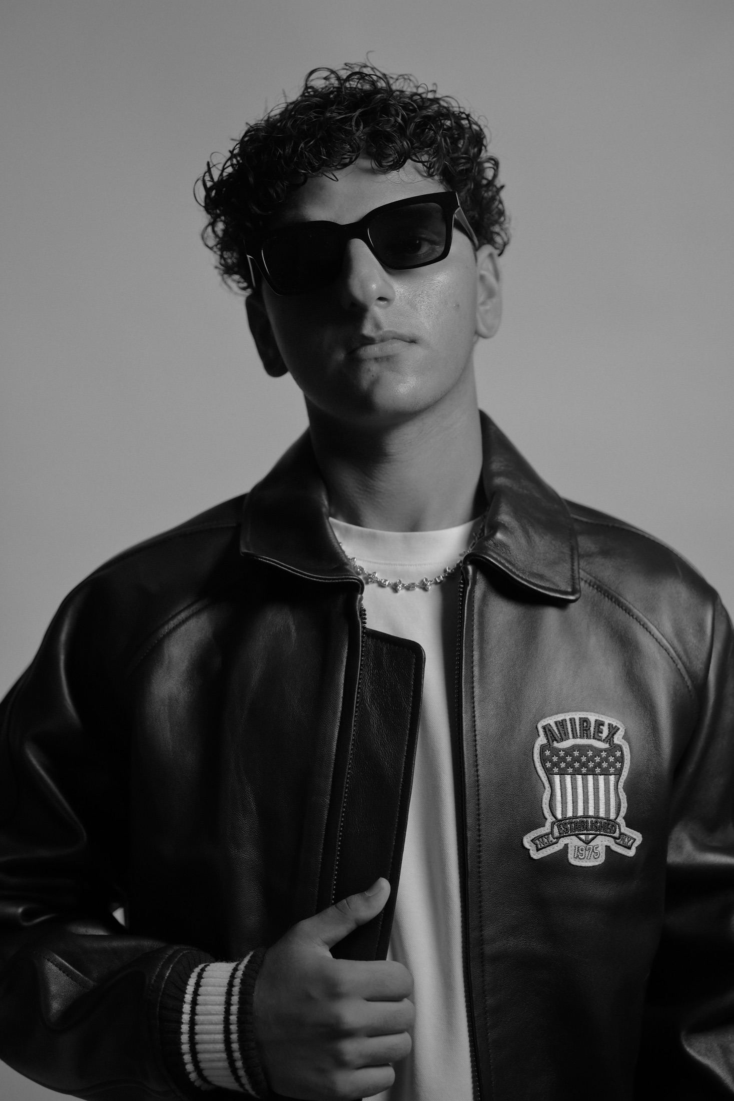 JIANNU wearing a leather jacket and sunglasses