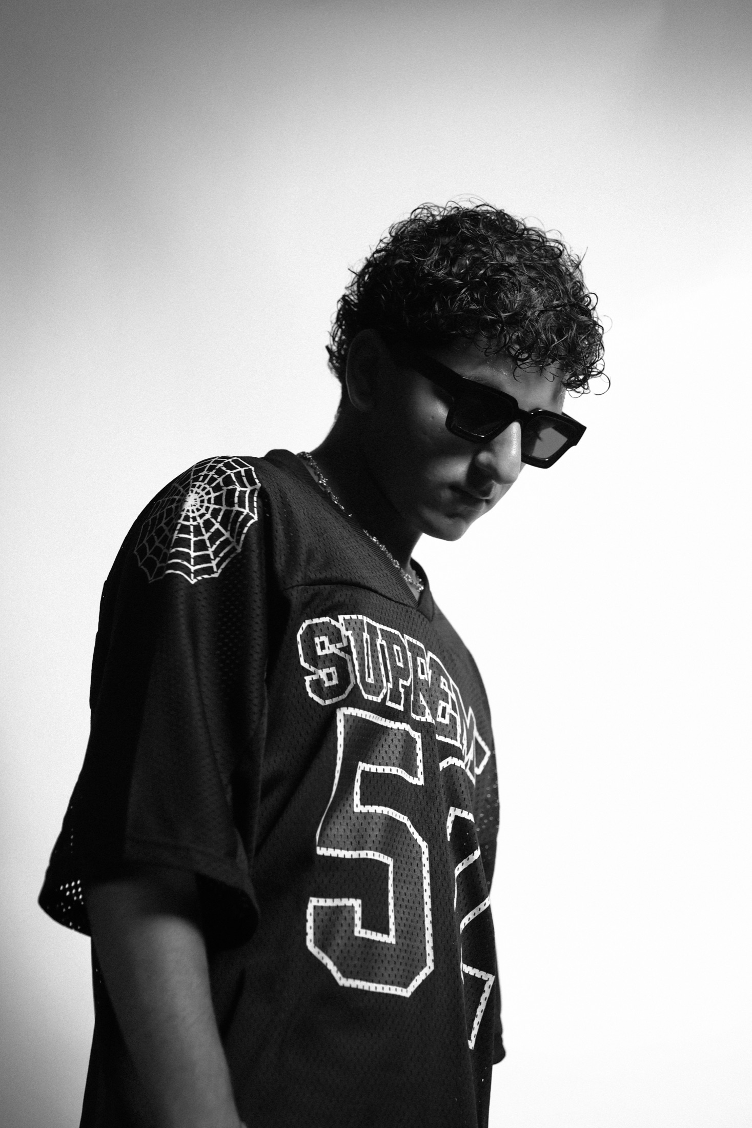 JIANNU in a Supreme jersey and sunglasses