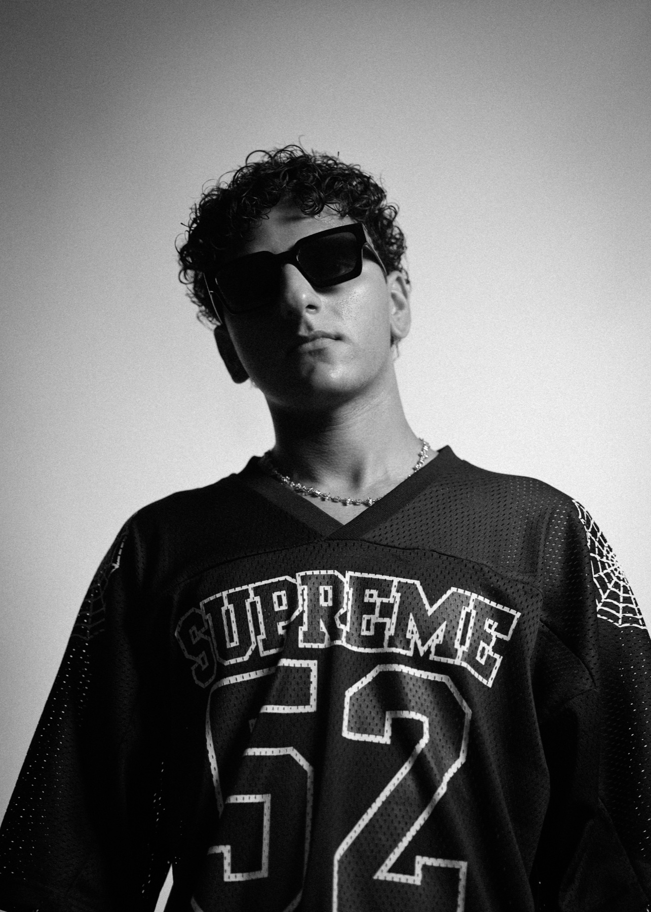 JIANNU in a Supreme jersey and sunglasses